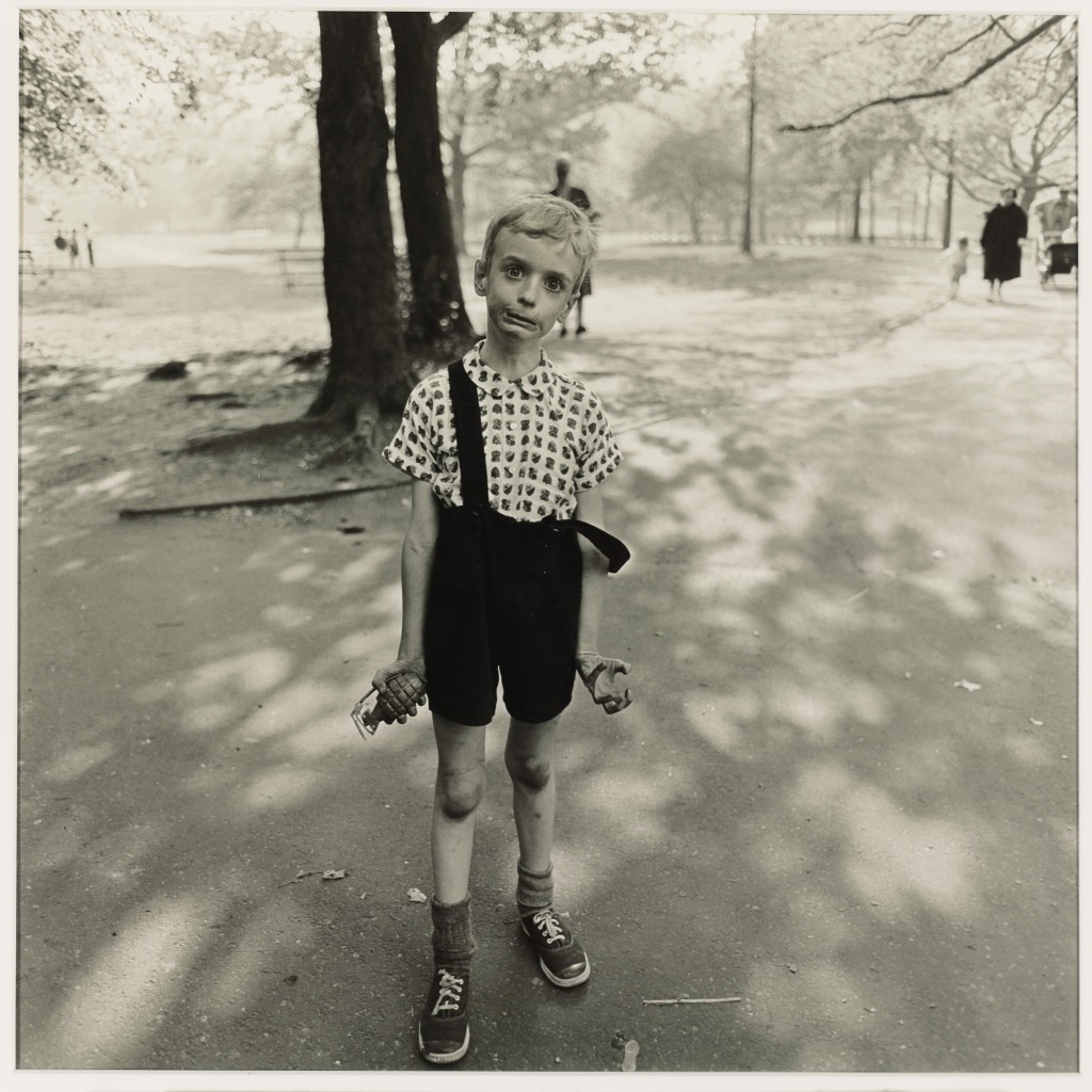 Child with a toy hand grenade in Central Park, NYC