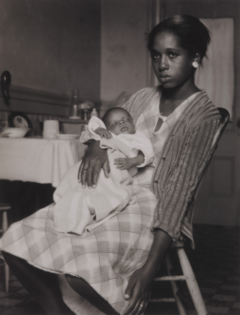 Young black woman with infant